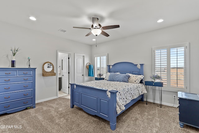 bedroom with multiple windows, light carpet, and ceiling fan