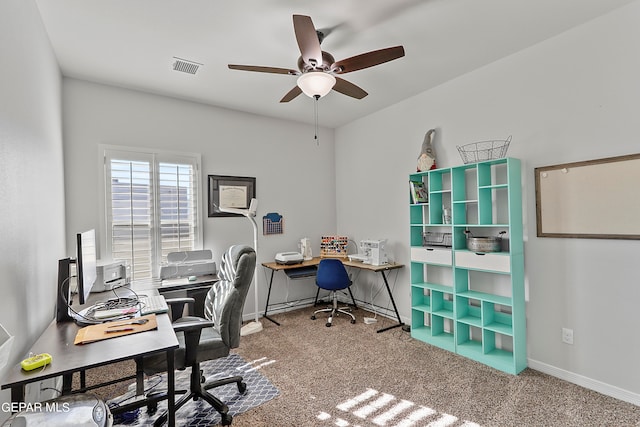 home office featuring carpet and ceiling fan