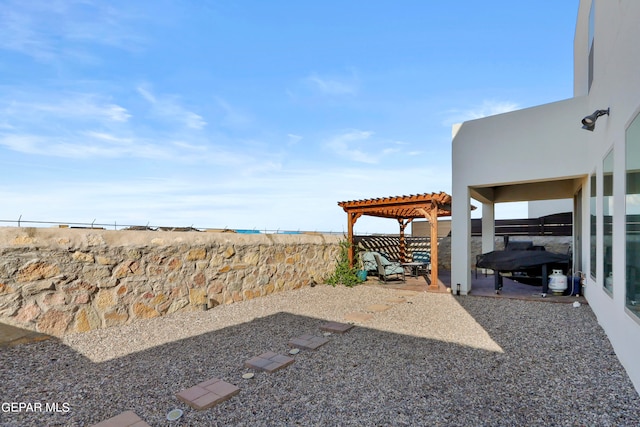 view of yard with a pergola and a patio area