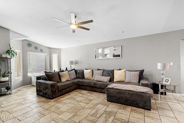 living room featuring lofted ceiling and ceiling fan