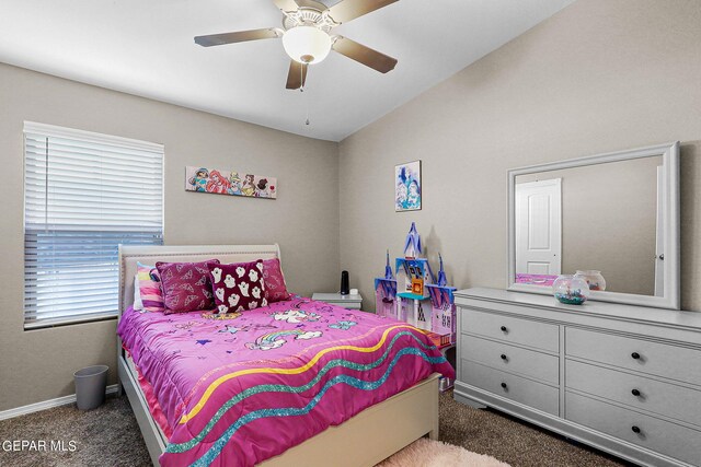 carpeted bedroom with ceiling fan, vaulted ceiling, and multiple windows