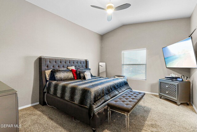 carpeted bedroom featuring ceiling fan and vaulted ceiling