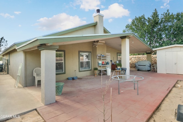 view of patio with a storage shed