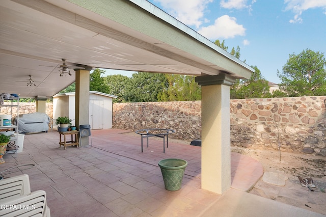 view of patio featuring a storage shed