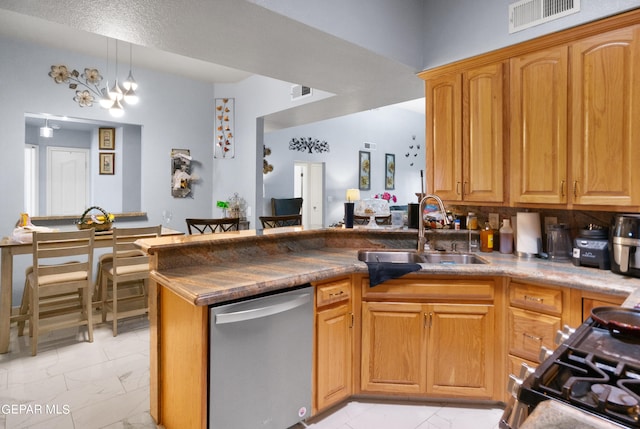 kitchen featuring dishwasher, a textured ceiling, sink, an inviting chandelier, and decorative light fixtures