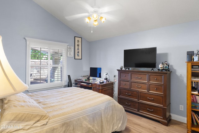 bedroom with light hardwood / wood-style floors, lofted ceiling, and ceiling fan