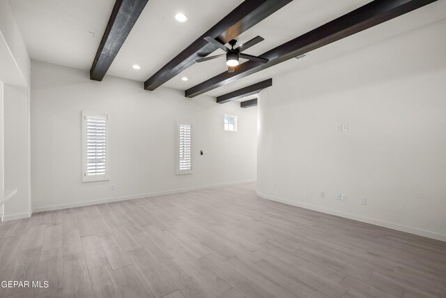 empty room featuring ceiling fan, beamed ceiling, and light wood-type flooring