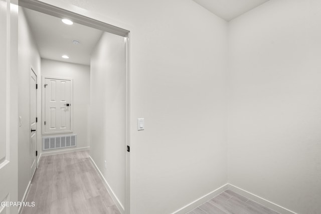 corridor featuring light hardwood / wood-style flooring