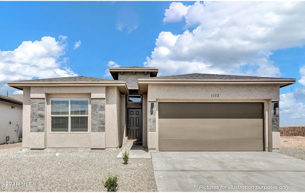 prairie-style house with a garage