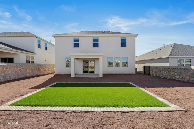 back of property featuring a patio