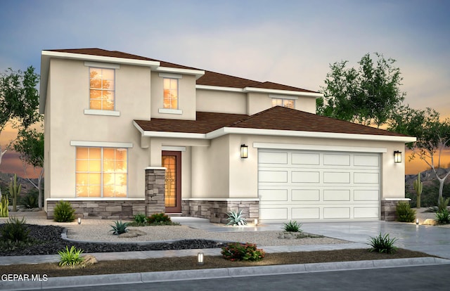 view of front of property with a garage