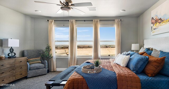 carpeted bedroom featuring ceiling fan