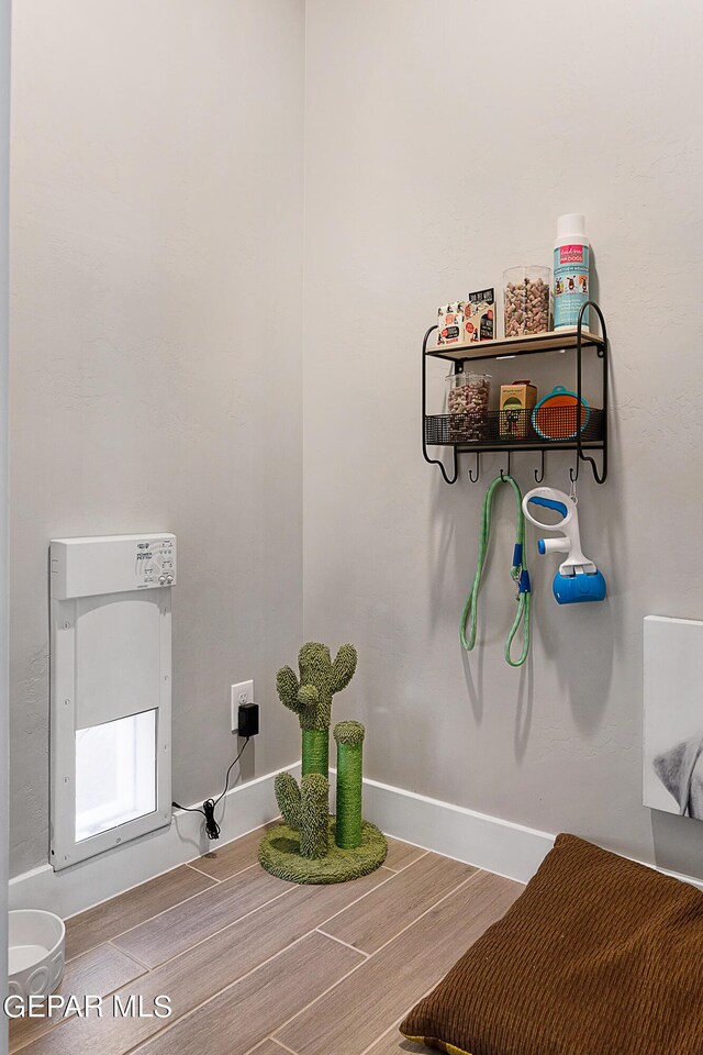 bathroom with hardwood / wood-style floors