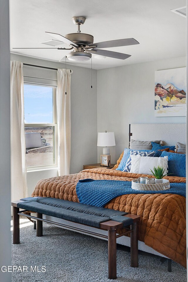 carpeted bedroom with ceiling fan