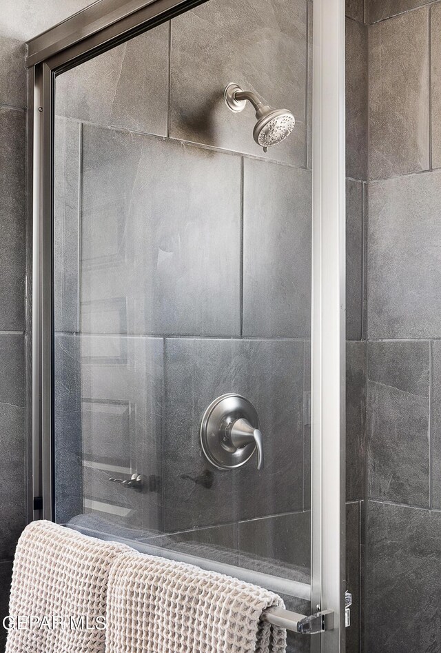 bathroom featuring an enclosed shower