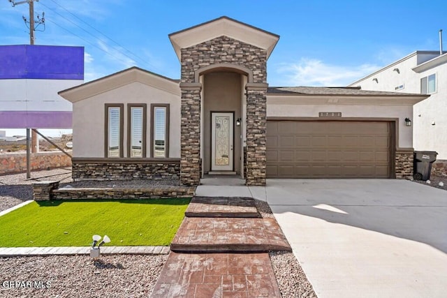 view of front of home with a front yard and a garage