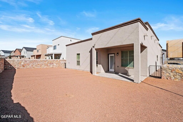 back of house featuring a patio area