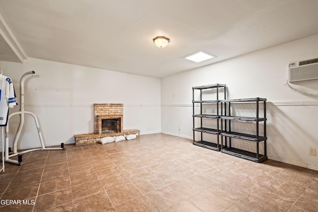 interior space with an AC wall unit and a fireplace