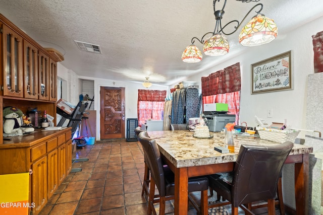 dining area with a textured ceiling