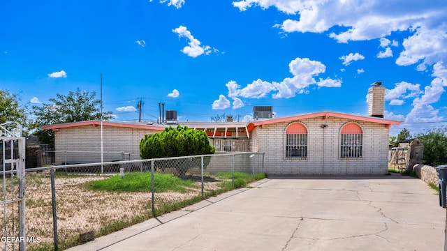 ranch-style house with central air condition unit