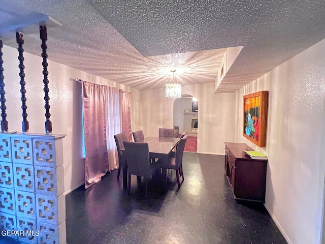 dining area featuring a textured ceiling