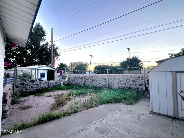 exterior space with a shed