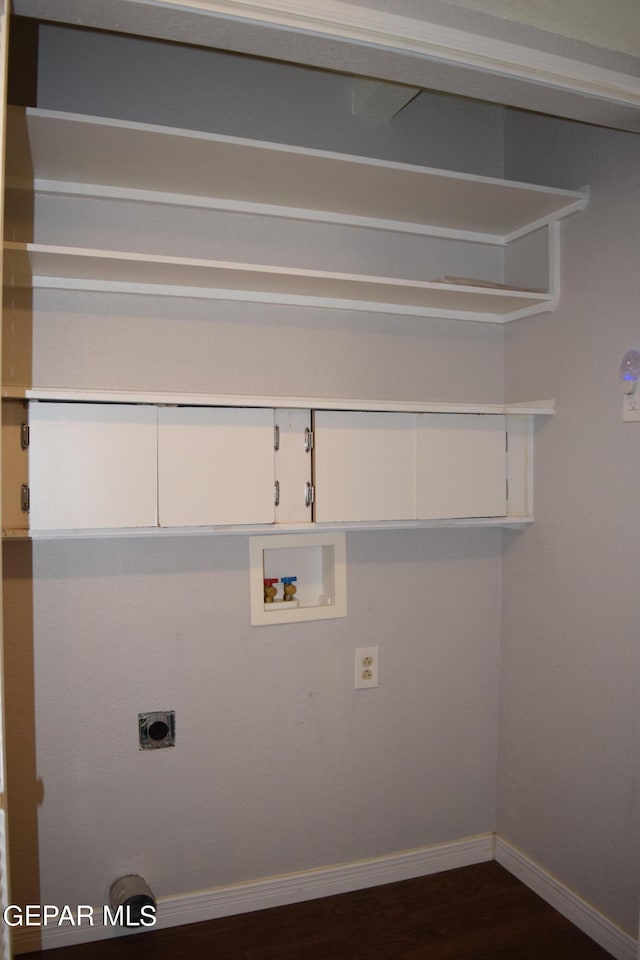 laundry room with hookup for a washing machine, dark wood-type flooring, and electric dryer hookup