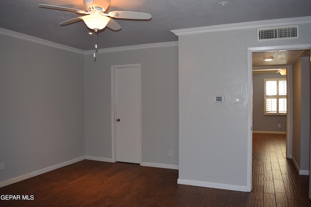 spare room with ornamental molding, a textured ceiling, ceiling fan, and dark hardwood / wood-style flooring