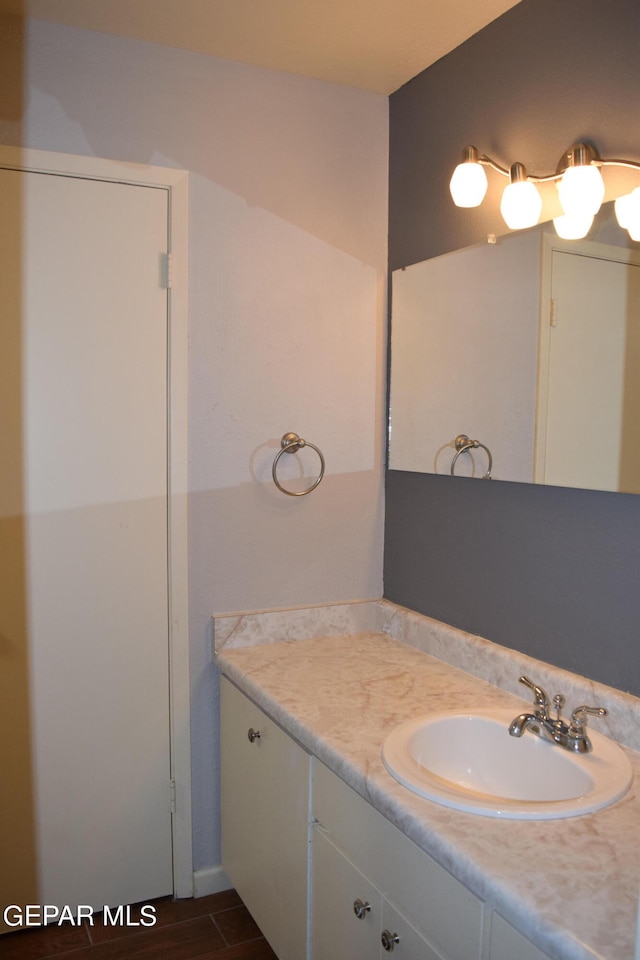 bathroom featuring wood-type flooring and vanity