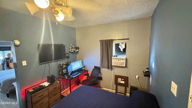 bedroom with a textured ceiling and ceiling fan