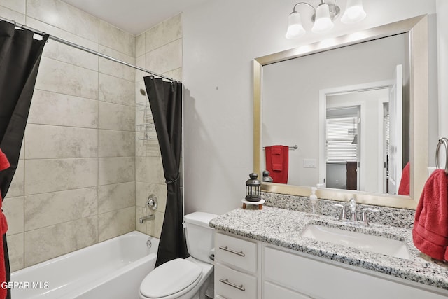 full bathroom with shower / tub combo, vanity, and toilet