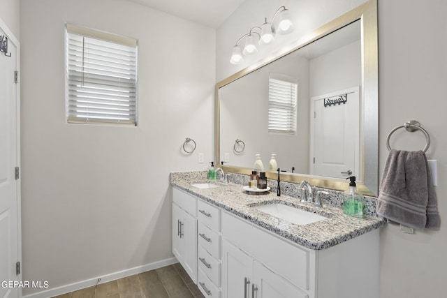 bathroom featuring vanity and hardwood / wood-style flooring