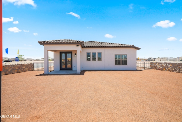 back of property featuring french doors