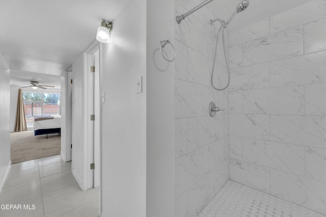 bathroom with ceiling fan, tile patterned floors, and tiled shower