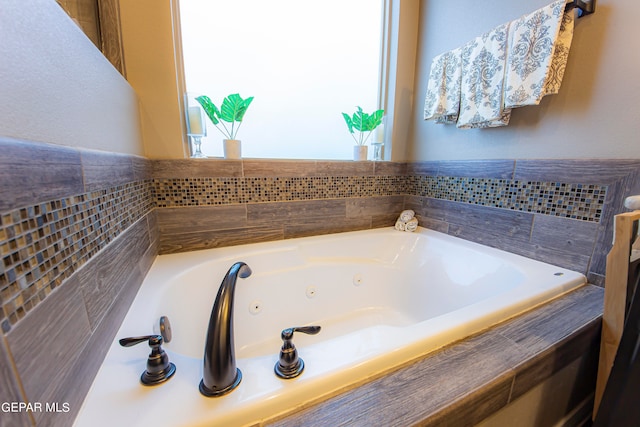 bathroom with a tub to relax in