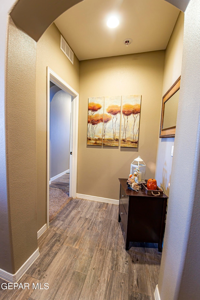 corridor featuring dark hardwood / wood-style floors