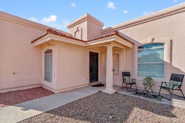 property entrance with a patio