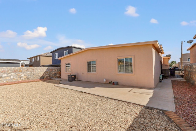 rear view of property featuring a patio area