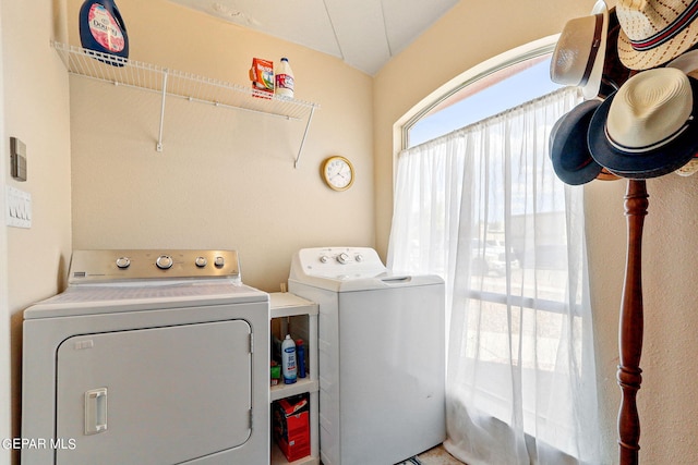 laundry room with separate washer and dryer