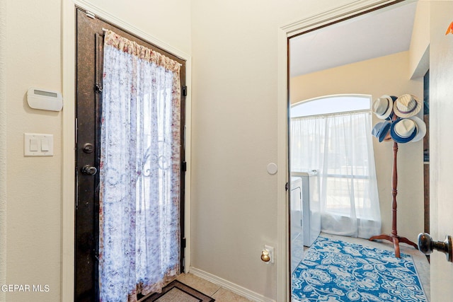 bathroom with tile patterned floors and a wealth of natural light