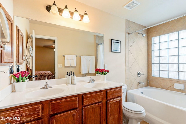 full bathroom featuring vanity, toilet, and shower / tub combo with curtain