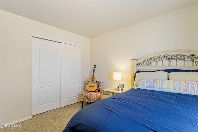 carpeted bedroom featuring a closet