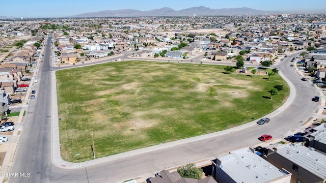 birds eye view of property with a mountain view