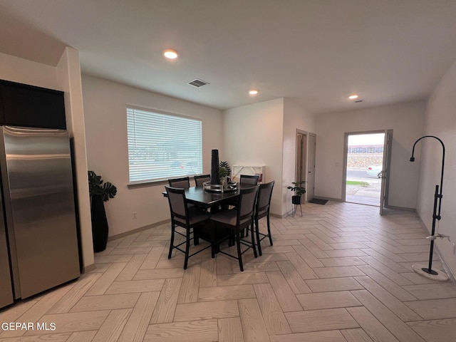 dining area with light parquet flooring