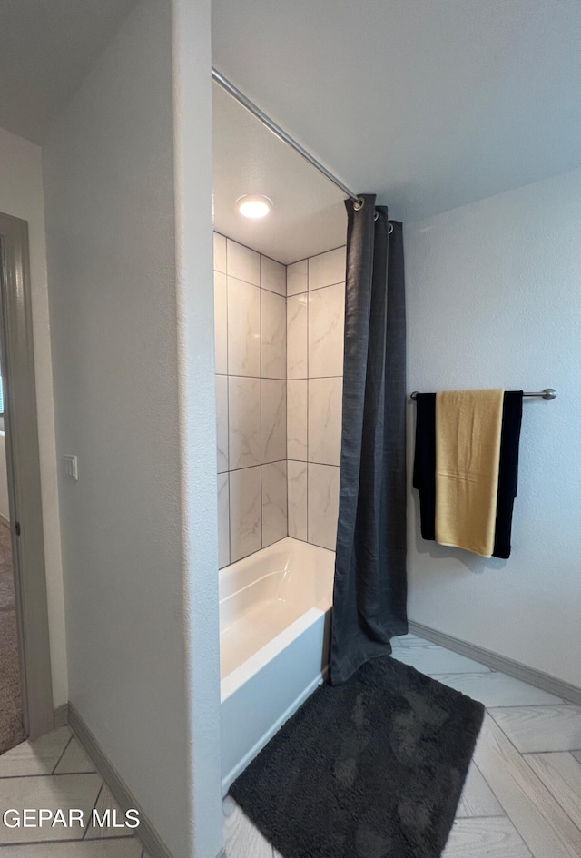 12832 Star Gaze Ave, El Paso, TX 79928 - bathroom featuring shower / bathtub combination with curtain, baseboards, and tile patterned floors