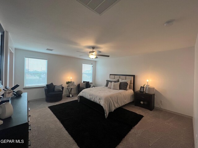 bedroom with light carpet and ceiling fan