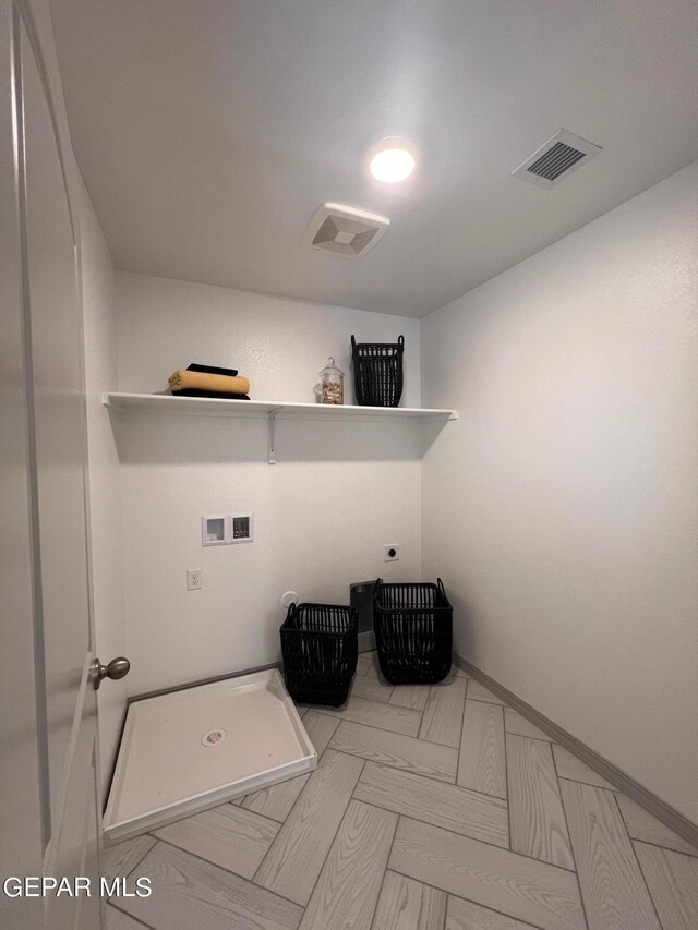 laundry room featuring washer hookup and electric dryer hookup