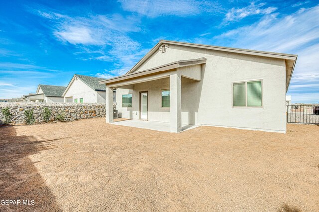 rear view of house with a patio