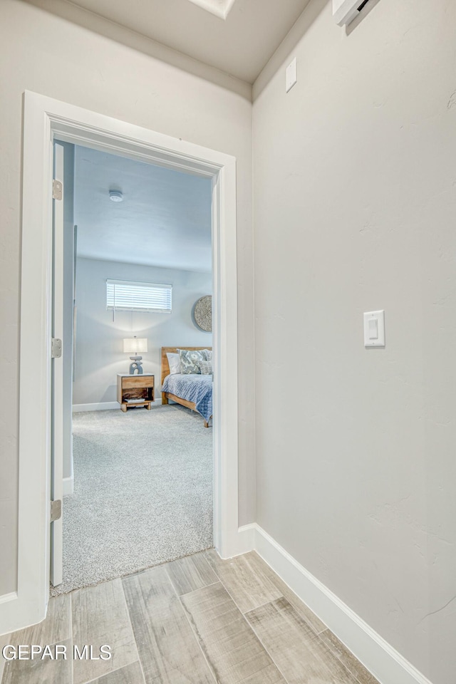 corridor featuring carpet floors