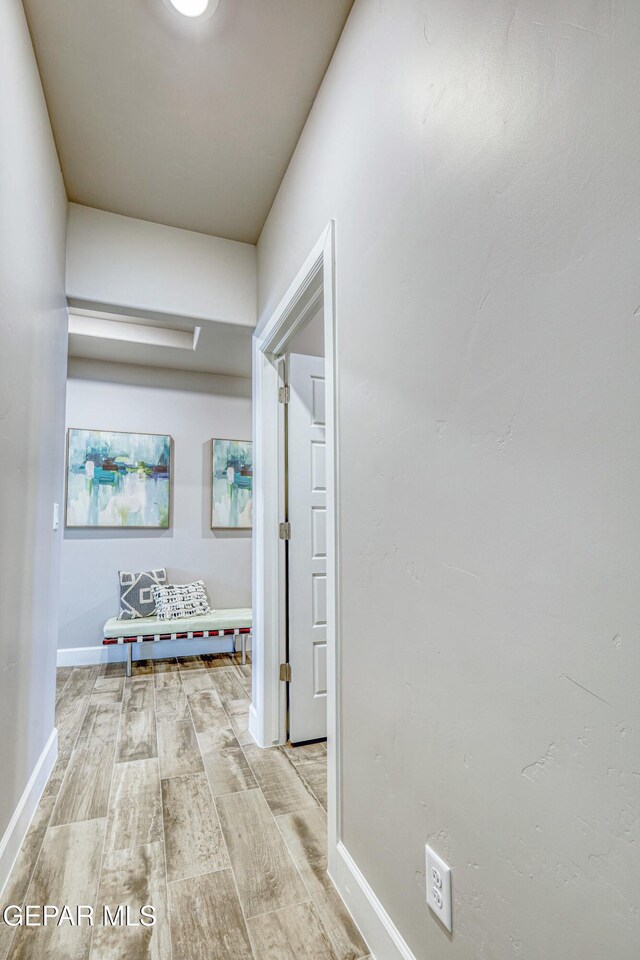 hallway with light wood-type flooring